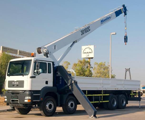 Crane truck lifting on a construction site
